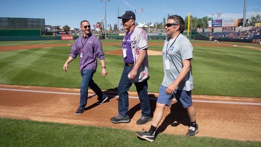 Dave Pierson walks on the Greater Nevada Field with Dr. Perry and Dr. Pence
