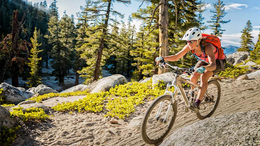 A woman mountain biking on the Tahoe Rim Trail