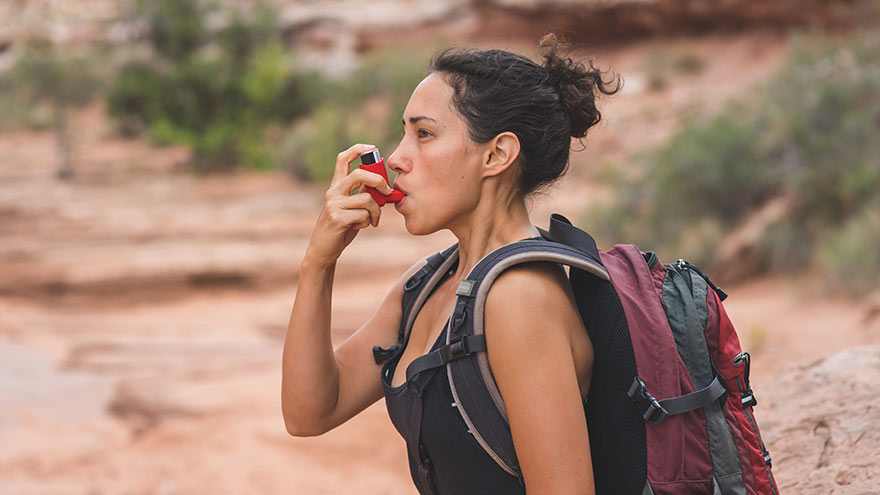 Woman With Chronic Asthma Hiking in Desert 